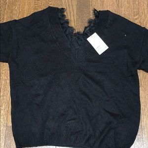 Black v-neck lace outlined sweater. NWT